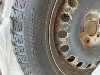 Selling four Radial 225/60 R17 snow tires. The tires are on rims. Slight rust to the rims. No punctu...
