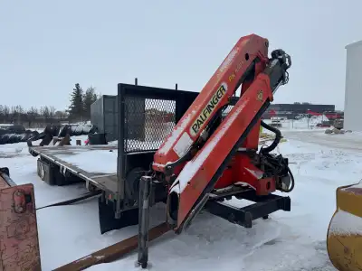 Knuckleboom crane and 18’ steel deck on subframe. Wireless remote, hydraulic outriggers, 24’ of reac...