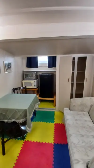 EVERYTHING INCLUDED Large fully furnished suite available immediately in basement with double bed, 2...