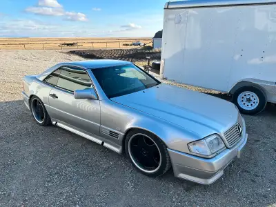 I am selling my Mercedes 500SL or SL500 The bad: There is very small hail damage on the trunk, top p...