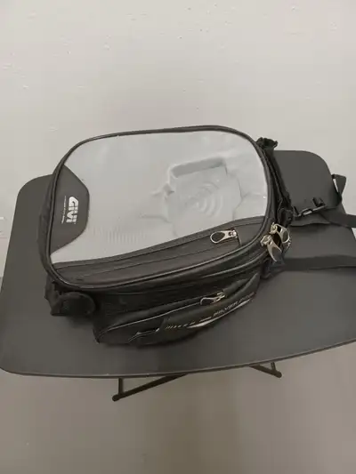 Moving Sale.. Almost new condition, looks great, main storage compartment, 2 pockets and the tank ba...