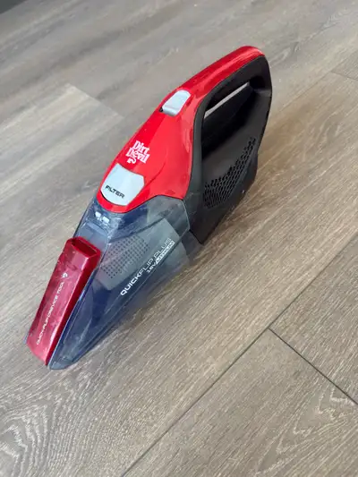 This is a used Dirt Devil Quick Flip Plus 16V Lithium handheld vacuum, perfect for quick cleanups ar...