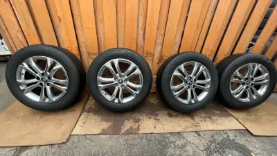 I'm selling a set of used Toyota wheels with Bridgestone Turanza LS100 tires, size P235/60R18. The t...