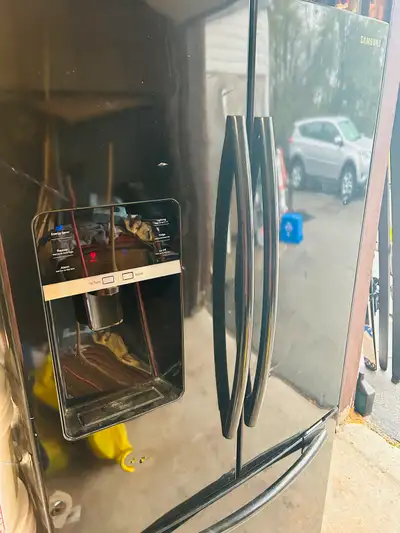 Black Samsung refrigerator excellent for the garage, View more