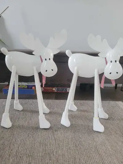 two moose Christmas decorations., View more