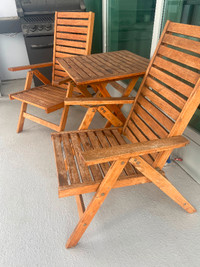 Teak wood patio set . Two chairs and a table .