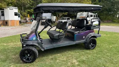 Fully loaded 6 seater golf cart. Rain and cool weather cover. Lithium 105ah 51v Inverter 120v AC 150...