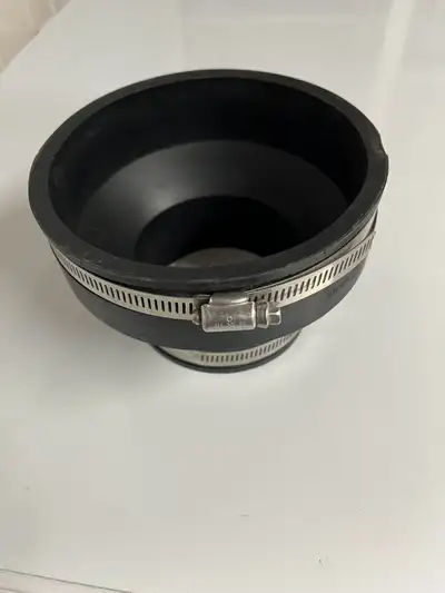 A new rubber pipe connector for clay to plastic or cast iron pipes, 4” to 3”.