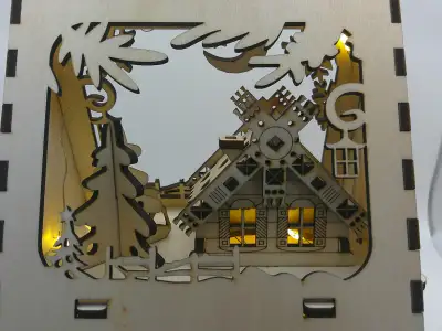 Christmas display with lights included. Dimensions are 5" wide by 6.25" tall. Made from 1/8" plywood...