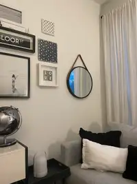 Target wall mirror with leather straps