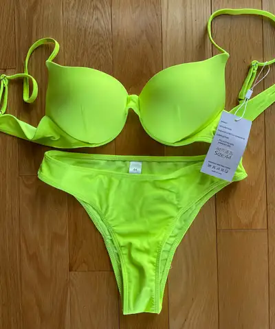Brand new with tags gorgeous and never worn neon bright yellow bikini to show off that bod and tan o...