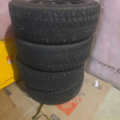 These pre-owned Michelin x- ice winter tires, size 225/65R17, are mounted on steel rims and are read...