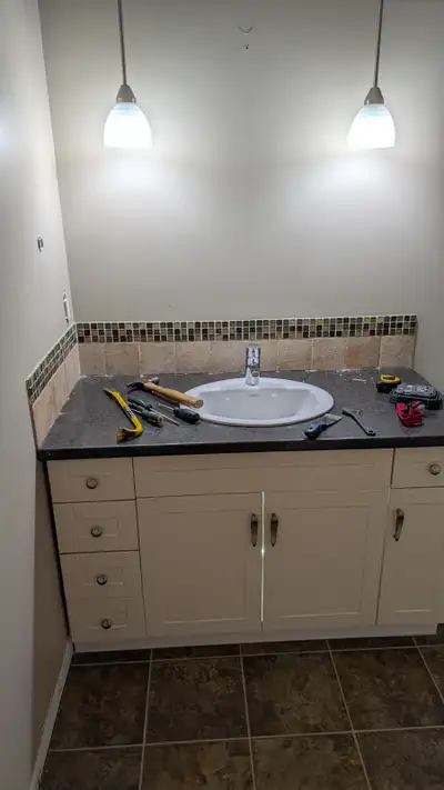 50" wide Bathroom Vanity with countertop, and sink. Bathroom lights and Toilet also available. All i...