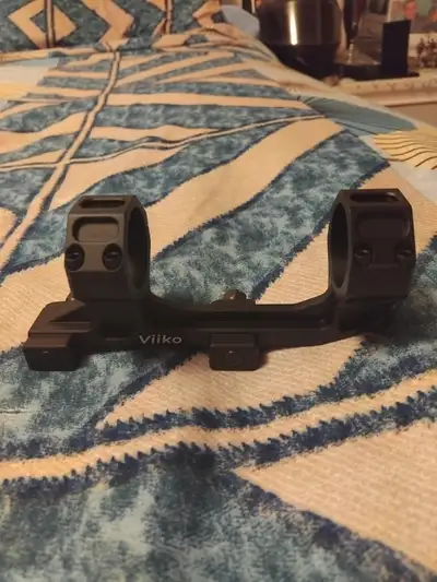 Scope mount that attaches the scope to your paintball/airsoft gun. New, never used. Cash and pickup...
