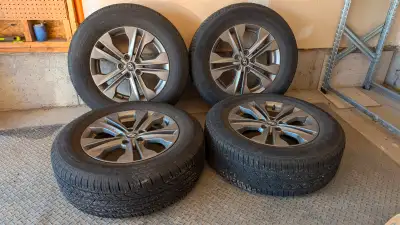 A set of 4 tires on rims. Within 4 tires, 2 of them(Toyo brand) are new with only 5K mileage worn, a...