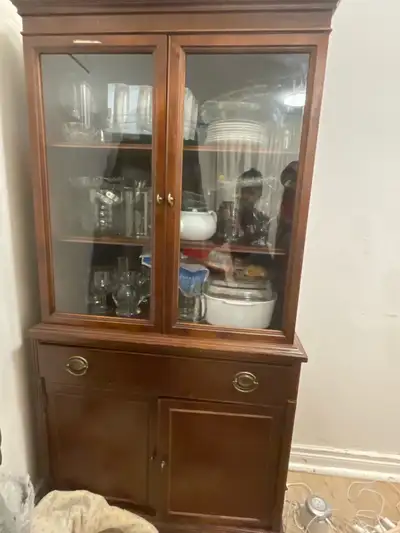 This beautiful, used china cabinet offers both display and storage solutions for your dining or livi...