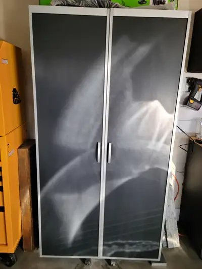 Garage storage cabinet with roll out doors that have storage., View more