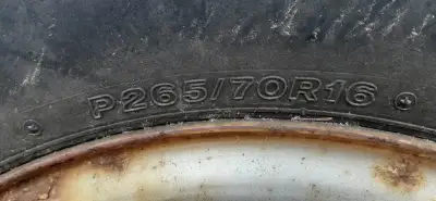 Set of four steel 16 inch rims, Chevy or GMC truck. Two of them have P265/70R16 tires on them with d...