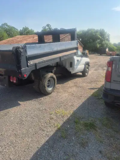 Nice running Duramax diesel, 4 x 4, 10' x 7.5'dump box wirh fold down sides and a tarp, lots of work...