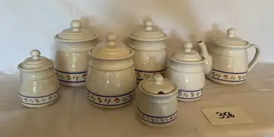 6 Cannisters and matching teapot: 1. 8.25 inches tall x 6 inch diameter 2. 7.75 inches tall x 5.5 in...