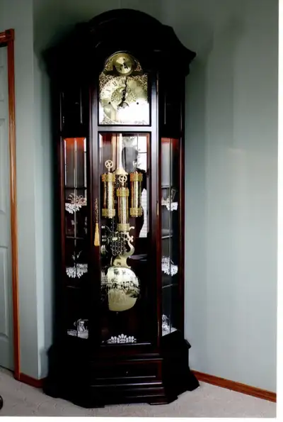 Gorgeous walnut grandfather clock, custom built in Germany’s Black Forest in 1989 while family was p...