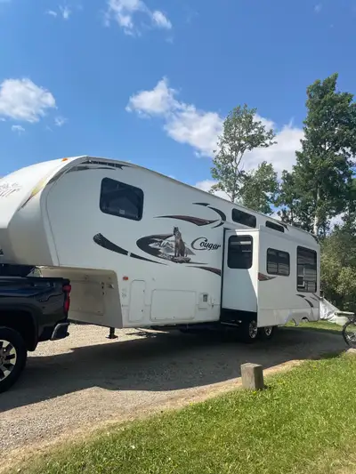 2010 Keystone Cougar 5th wheel Toy hauler. Good shape, no leaks and very clean. Located in Fort St....