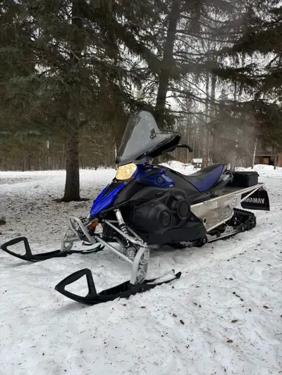 Snowmobile is like new. 4 stroke engine with electronic reverse and 144” track.