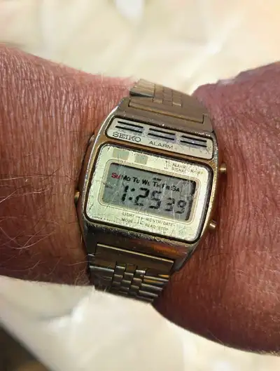 Seiko Alarm digital watch features a timeless retro aesthetic; it shows signs of wear consistent wit...