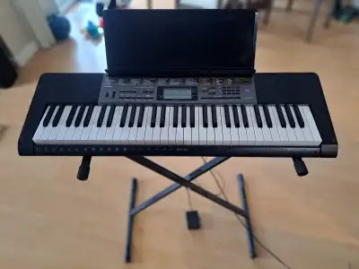 For sale: Beautiful lightly used Casio LK-265 Portable keyboard with 61 full-size, lighted keys. A p...