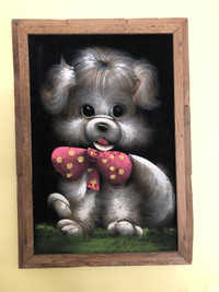 Vintage black velvet puppy dog painting in rustic wood frame