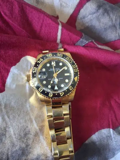 Gold plated stainless steal watch, View more
