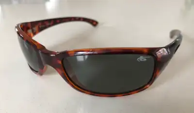 Genuine. Brown tortoiseshell frame, grey lenses. Polarized. Brand logo inserts are missing from both...