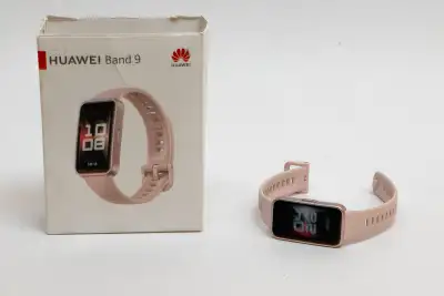 Used – like new Brand HUAWEI Fitness tracker watch with pink strap (interchangeable). Box is in bad...