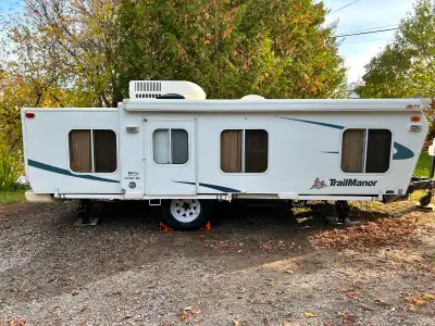 -SOLD - Unique travel trailer, folds down for easy towing, easy setup with solid sides. 1 queen bed,...