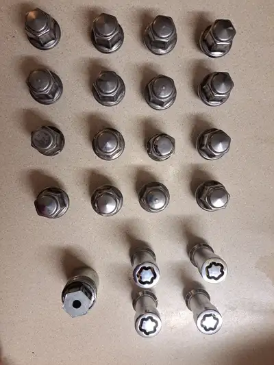 For sale is this full set of chromed lug nuts from a 2015 Ford Focus ST with a set of McGard locking...