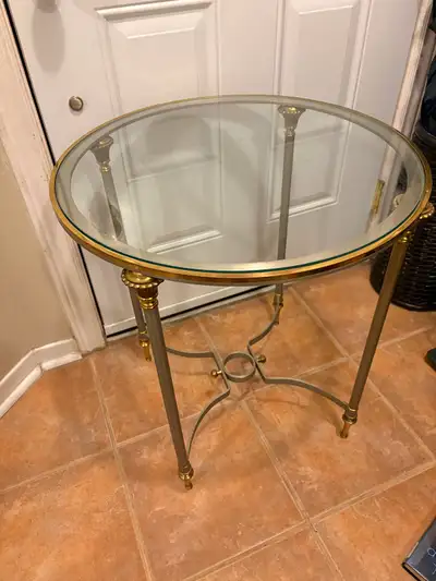 Maison Janse glass top brass rimmed end table, metal sides $400, View more