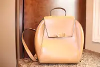 Tan coloured leather backpack by Danier Leather