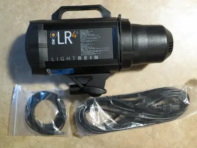 For sale is a 2nd generation Lightrein LR4A 400WS AC plug in studio flash with Manfrotto Gruppo ligh...