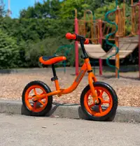 Orange toddler balance bike 12", it is brand new