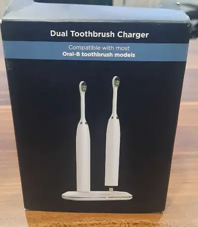 Two-in-one charging station for Oral-B electric toothbrushes. Includes charging cord
