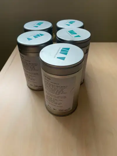 Five David’s tea empty canisters, View more