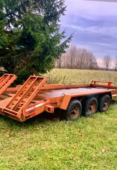 This is a heavy duty flatbed trailer, perfect for hauling onused trailer and shows some signs of wea...