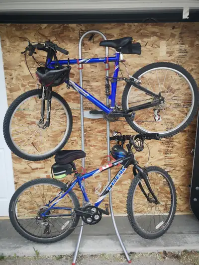 This modern style 2-bike stand is the ideal space-saving solution for bike storage in the house, gar...