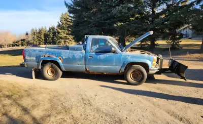 Old rusty but trusty chev 1 ton 4x4 with heavy duty snow plow. Located at Lake Ilse, about 45 mins w...