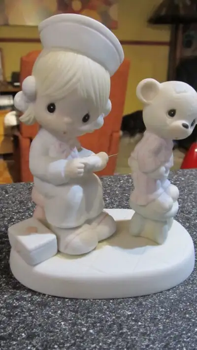 Precious Moments Love beareth all things figurine., View more