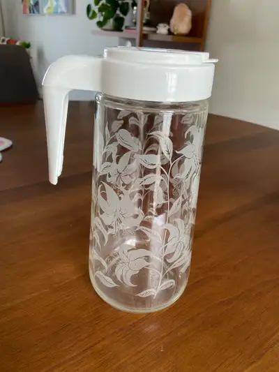 Vintage Tang clear etched glass lily design Pitcher Carafe with white lid. Made by Anchor Hocking