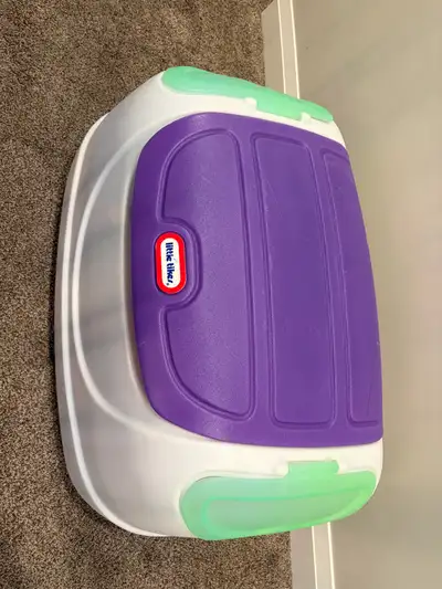 This Little Tikes toy chest, with its vibrant purple lid and white base, is perfect for keeping your...