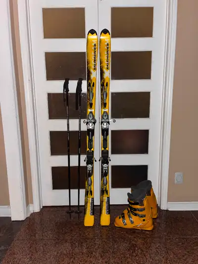 179 Salomon ski with boots ,poles, View more