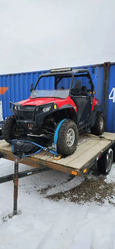 2011 rzr 800s with utility trailer. Unsure of the kms as I have the battery pulled atm. Around 5000k...