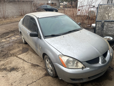 20004 Mitsubishi lancer rolling shell